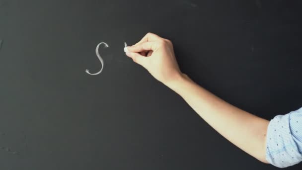 Female Hand Writes White Chalk Black Blackboard Two Words School — Stock Video