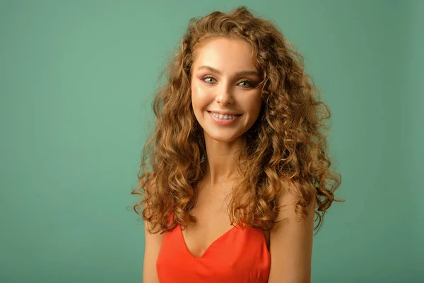 Closeup studio portrait of pretty girl with long curly hair — Stock Photo, Image