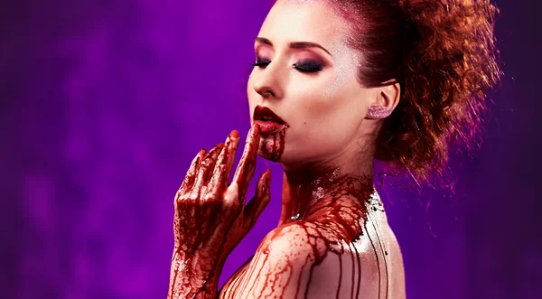 Beautiful sexy young woman. Body covered with a blood — Stock Photo, Image