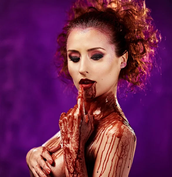 Beautiful sexy young woman. Body covered with a blood — Stock Photo, Image