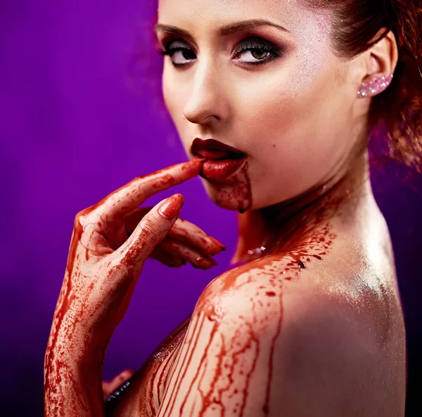 Beautiful sexy young woman. Body covered with a blood — Stock Photo, Image