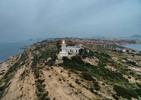 Lighthouse on a hilltop at early morning — Stock Photo, Image