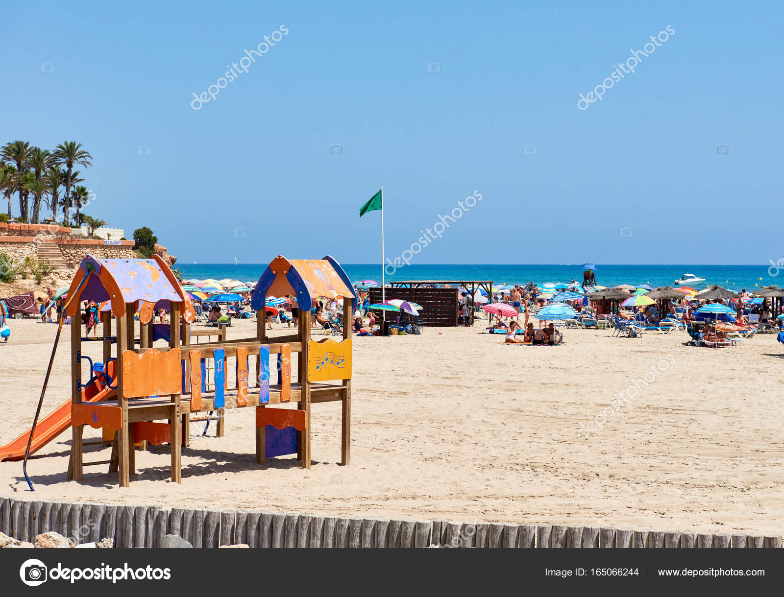 People Enjoying The Summer On The Beach Of La Zenia Spain