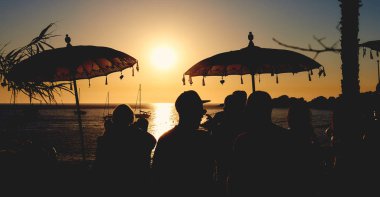 People during the sunset on the Calo des Moro in Ibiza. Spain clipart