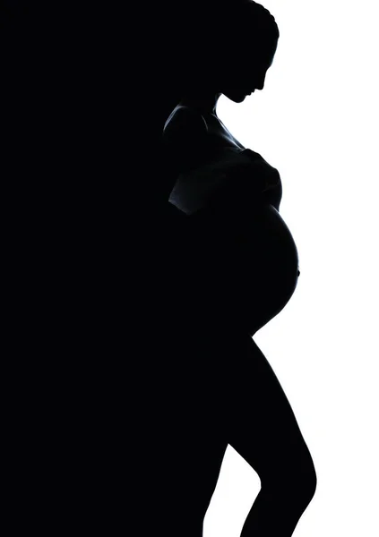 Schöne Silhouette einer schwangeren Frau. schwarz-weiß — Stockfoto