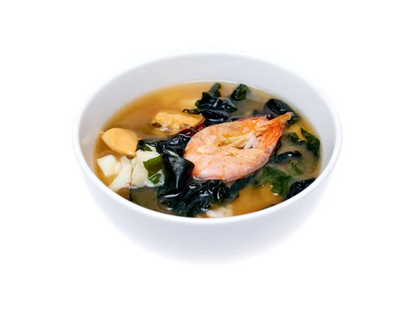 Bowl of seafood soup over white background — Stock Photo, Image