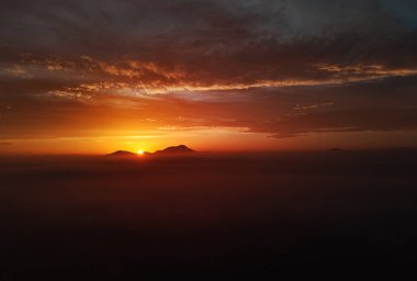 Aerial photo drone point of view horizon over land and glowing sun