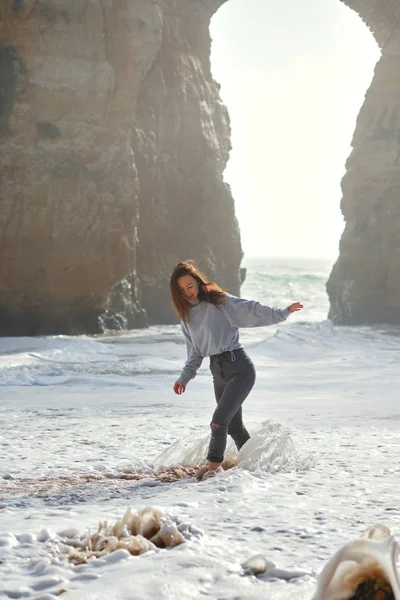 Cheery lively playful young woman enjoy surf of Atlantic Ocean foamy wavy waters laughing spend vacation on the beach in Lagos — 스톡 사진