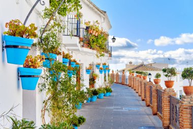 Idyllic scenery empty picturesque street of small white-washed village of Mijas.