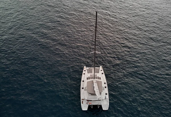 View from above drone point of view of white luxury catamaran in calm water of Atlantic Ocean — 图库照片