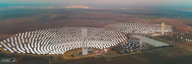 Aerial horizontal image Gemasolar Concentrated solar power plant CSP circle shape, system generate solar power using mirrors lenses to concentrate large area of sunlight onto receiver, Seville Spain clipart