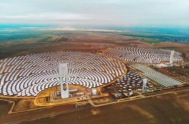 Image drone point of view Gemasolar Concentrated solar power plant CSP circle shape, system generate solar power using mirrors lenses to concentrate large area of sunlight onto receiver, Seville Spain clipart