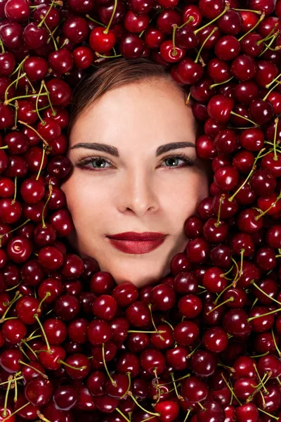 Beautiful woman with cherries