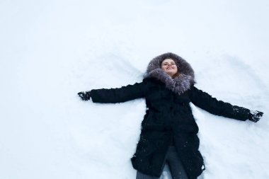 woman making snow-angel
