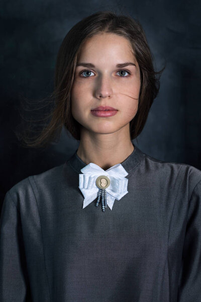 Dress with an old brooch