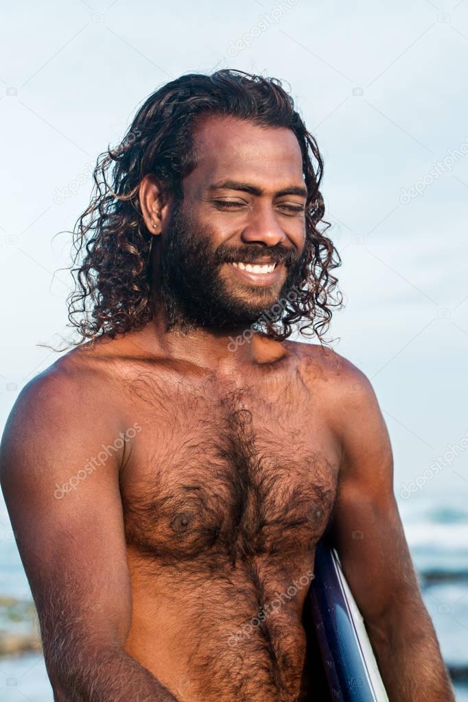 Portrait of a handsome surfer