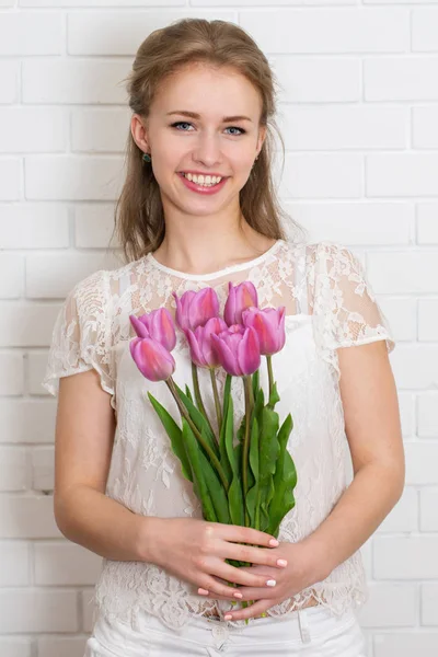 Woman with a bouquet — Stock Photo, Image