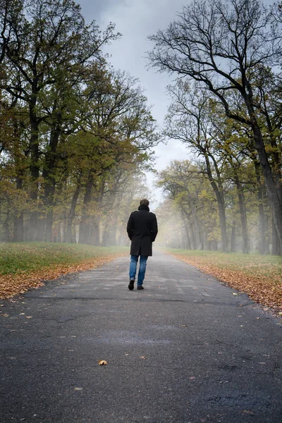 A man in a black coat — Stock Photo, Image