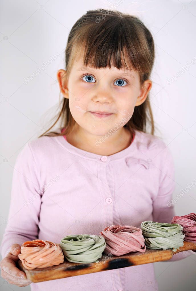 girl holding fettuccine pasta