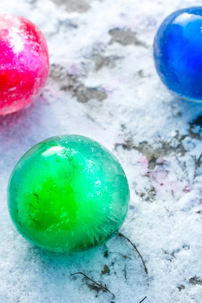 ice balls in the snow on a sunny day, top view