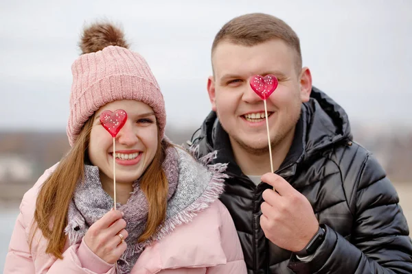 Boy and girl with to candy — Stock Photo, Image