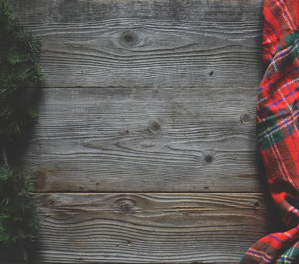 Flat lay of scarf with Christmas tartan texture and branch of tr — Stock Photo, Image