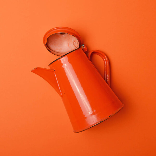 Retro orange tea pot on orange background  - Minimalism