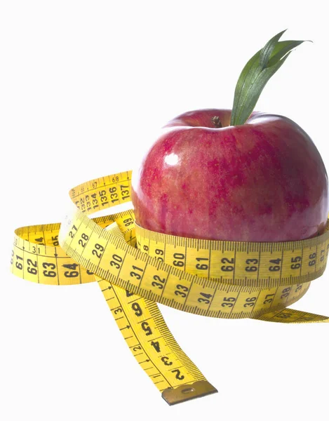 Apple and a measure tape - diet concept — Stock Photo, Image