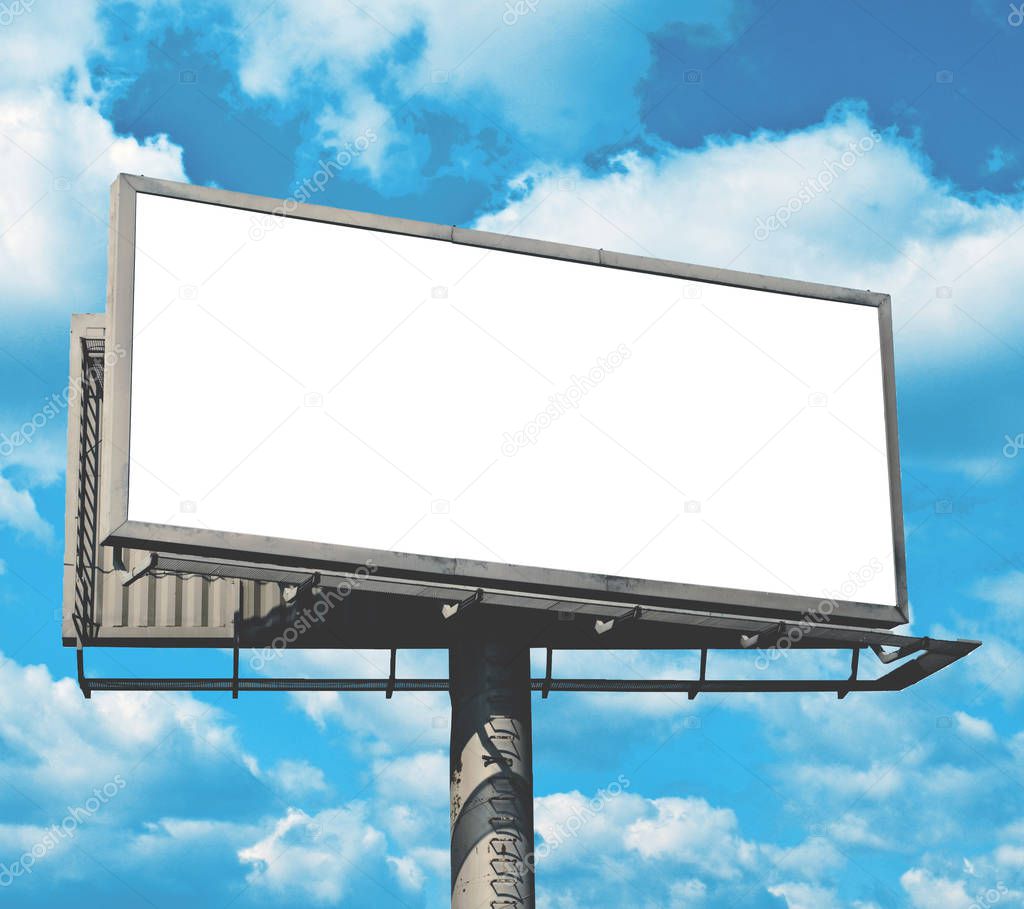 Blank billboard against bright blue sky