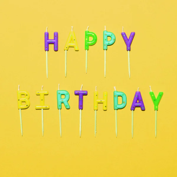 Happy Birthday flat lay party decorations on yellow background — Stock Photo, Image