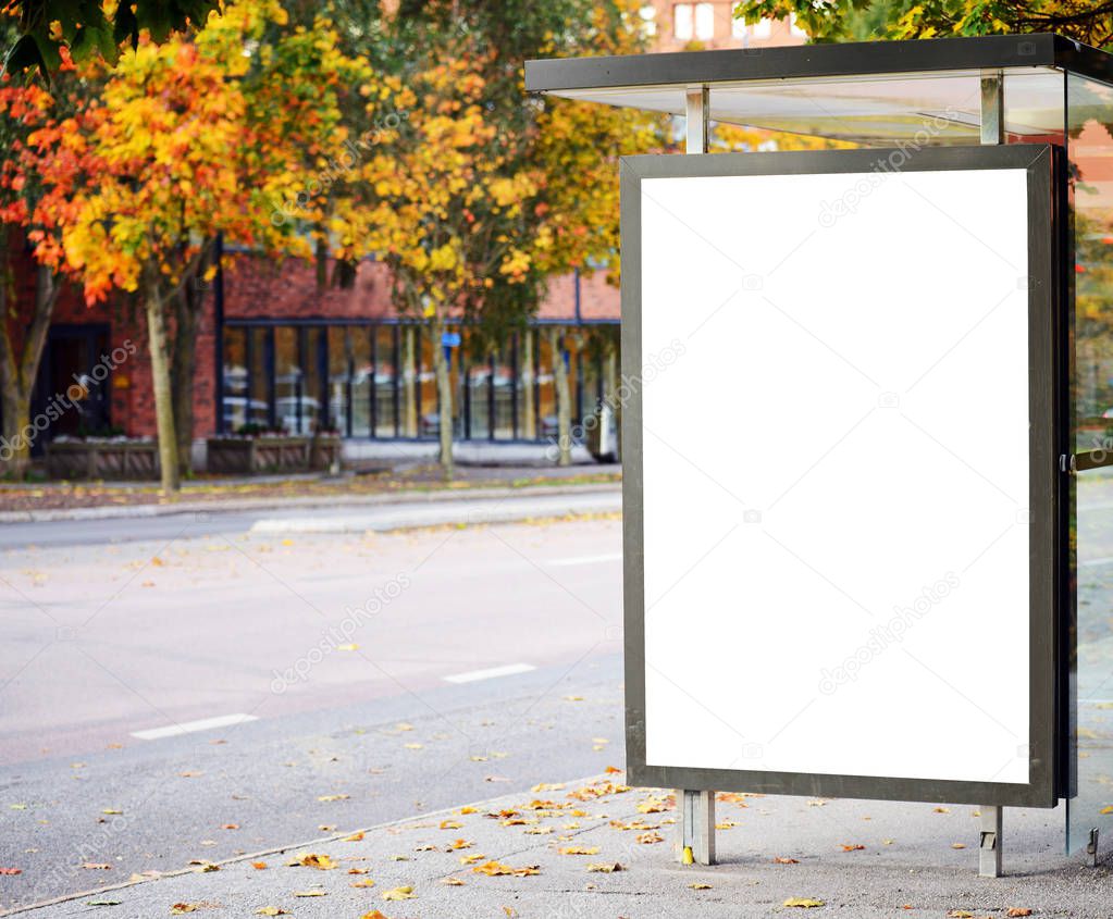 Blank billboard on city bus station