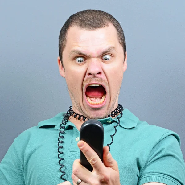 Man having unpleasant conversation on telephone — Stock Photo, Image