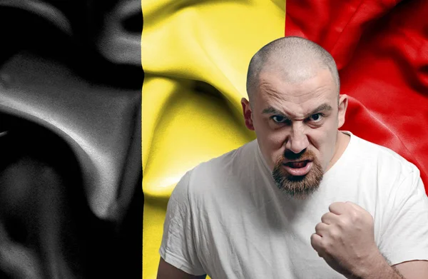 Angry man against flag of Belgium — Stock Photo, Image