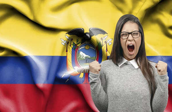 Ecstatic woman holidng fists and screaming against flag of Ecuad — Stock Photo, Image