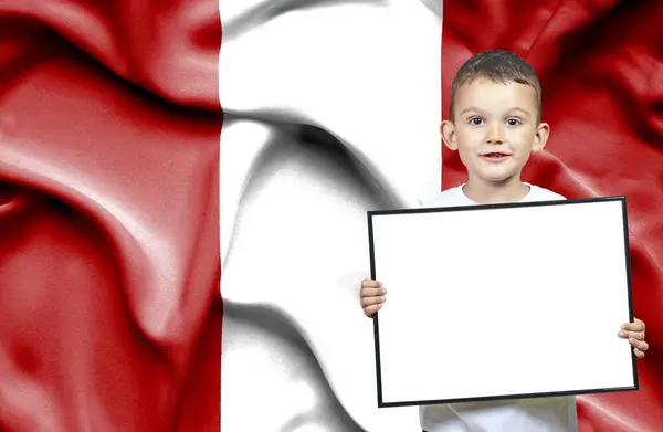 Cute small boy holding emtpy sign in front of flag of Peru — Stock Photo, Image