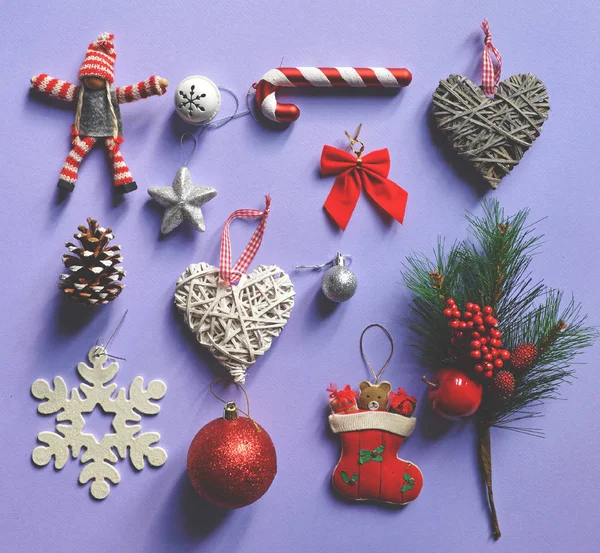 Flat lay of Christmas decoration and ornaments on purple backgro — Stock Photo, Image