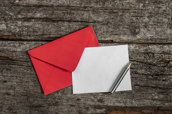Empty postcard in envelope — Stock Photo, Image
