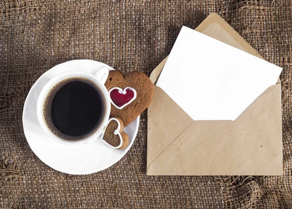 Coffee and a heart shaped cookie — Stock Photo, Image