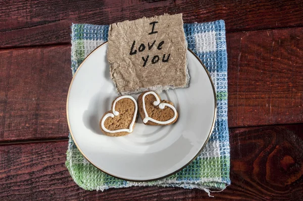 Heart shaped cookies on white sauser — Stock Photo, Image