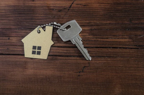 Symbol of the house with silver key — Stock Photo, Image