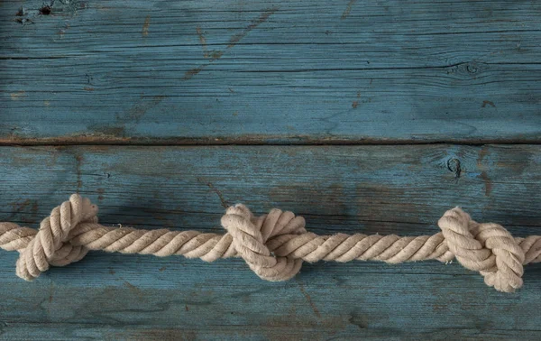 Rope knot on wood — Stock Photo, Image