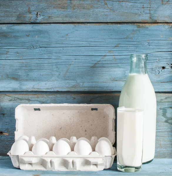 Fresh organic eggs, glass milk and bottle