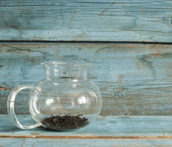 Glass teapot with black tea — Stock Photo, Image