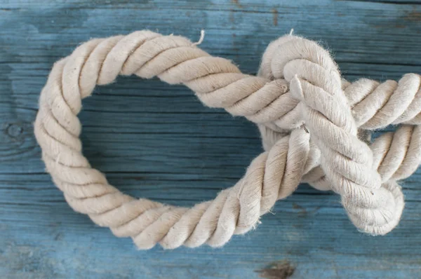 Ship rope on wooden background — Stock Photo, Image