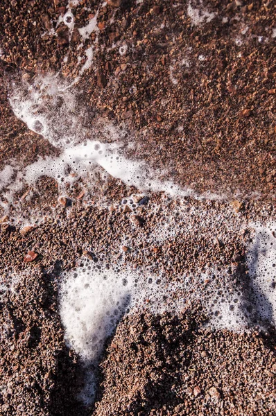 Zachte golf van de zee op het zandstrand — Stockfoto