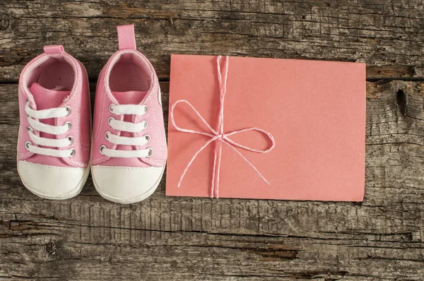 Baby shoes on wooden background — Stock Photo, Image