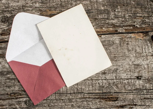 Envelope on a wood table — Stock Photo, Image