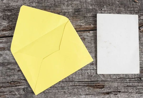 Envelope on a wood table — Stock Photo, Image