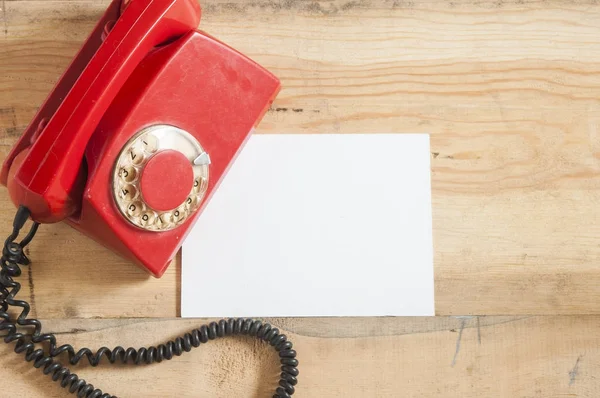 Stock image Retro rotary telephone on wood table