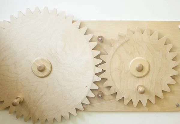 Gear wheels on wooden background — Stock Photo, Image